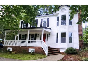Charming two-story home with a welcoming front porch and beautifully maintained landscaping at 5013 Brassfield Dr, Rocky Mount, NC 27803