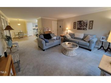 Cozy living room featuring neutral tones, comfortable seating, and stylish decor, creating an inviting atmosphere at 3523 Ivy Commons Dr # 102, Raleigh, NC 27606