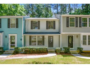 Charming townhomes with colorful siding and well-maintained landscaping at 603 Middleton Ave, Cary, NC 27513