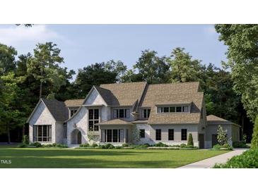 Charming two-story home featuring a landscaped yard, gray siding and stone accents under a light blue sky at 8425 Portmarnock Ct, Wake Forest, NC 27587