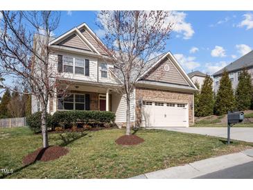 Charming two-story home featuring stone accents, a two-car garage, and a well-maintained front yard at 4 Seawell Ct, Durham, NC 27703