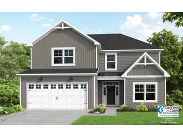Charming two-story home with gray siding, white trim, a two-car garage, and well-manicured lawn at 15 Malbec Way, Youngsville, NC 27596