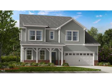 Charming two-story home with gray siding, a covered front porch, and a two-car garage at 204 Seagraves Creek Ln, Holly Springs, NC 27540