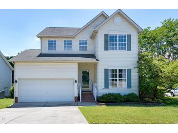Charming two-story home with a well-maintained lawn, attached garage, and inviting curb appeal at 4725 Parr Vista Ct, Raleigh, NC 27612