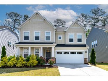 Charming two-story home with a well-manicured lawn, attached garage, and lovely landscaping at 108 Valley View Dr, Chapel Hill, NC 27516