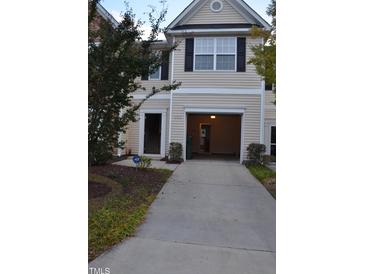 Two-story home featuring an attached garage and manicured landscaping at 958 Shining Wire Way, Morrisville, NC 27560