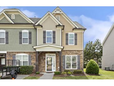 Charming townhouse with stone accents, neutral siding, and well-maintained landscaping at 223 Morgan Brook Way, Rolesville, NC 27571