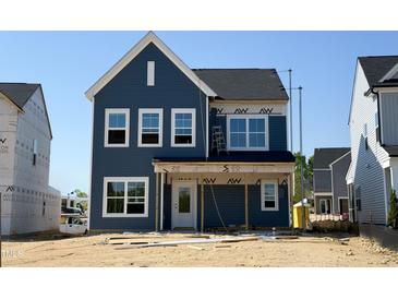 New two-story home with blue siding and white trim under construction on a sunny day at 261 Marvel Dr # 136, Rolesville, NC 27571