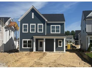 Charming two-story home features a welcoming front porch and classic architectural details at 261 Marvel Dr # 136, Rolesville, NC 27571