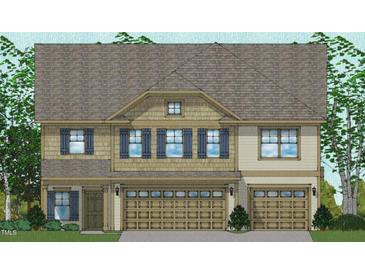Charming two-story home featuring blue shutters, a beige exterior, and a two-car garage at 30 Bold Dr, Youngsville, NC 27596