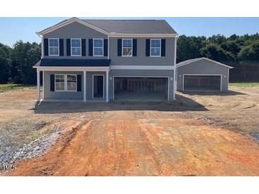 New two-story home with a separate two-car garage and a wide driveway at 59 Sagamore Avenue, Angier, NC 27501