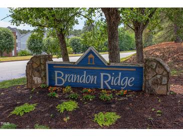 Community sign for Brandon Ridge sits amongst trees and flowering plants at 600 Audubon Lake Dr # 6B13, Durham, NC 27713