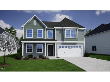 Charming two-story home with a well-manicured lawn, attached garage, and beautiful window trim at 84 Sagamore Avenue, Angier, NC 27501