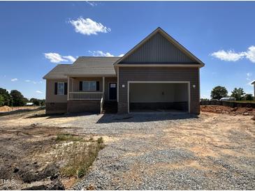 Charming single-Gathering home with covered porch and a two-car attached garage, perfect for a growing Gathering at 112 Royal Ave, Selma, NC 27576