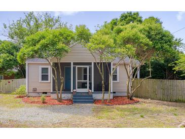 Charming home featuring beautiful trees and landscaping, offering great curb appeal at 1429 Hudson Ave, Durham, NC 27705