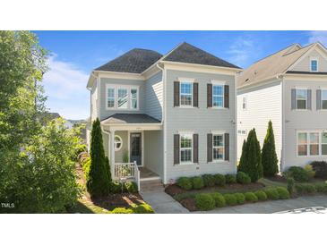Charming two-story home with beautiful landscaping and a welcoming front porch at 1641 Silo Ridge Dr, Wake Forest, NC 27587