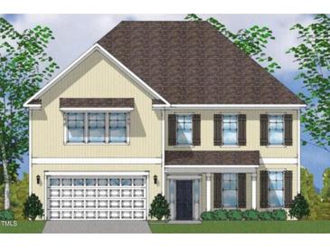 Charming two-story home with a two-car garage, complementary shutters, and manicured landscaping at 55 Guardian St, Youngsville, NC 27596
