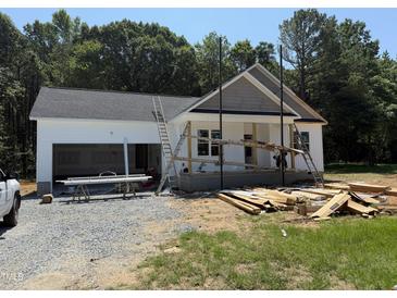 An exterior view of a home under construction with white siding and a grey shingled roof at 13159 S Nc-231 Hwy, Middlesex, NC 27557