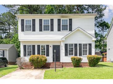Charming two-story home with white siding, black shutters, and a well-maintained front yard and entryway at 3713 Phillips W Way, Durham, NC 27713