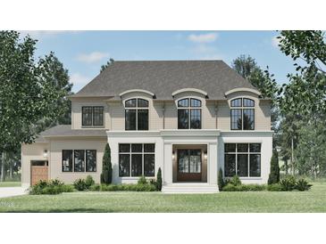 Stunning two-story home with a brick facade, elegant windows, and manicured landscaping at 4500 Latimer Rd, Raleigh, NC 27609