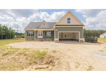 Charming home with attached garage and inviting curb appeal at 25 Sanders Farm Dr, Smithfield, NC 27577