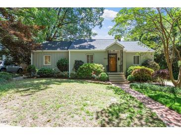 Charming single-story home with well-maintained lawn and mature trees at 2823 Fowler Ave, Raleigh, NC 27607