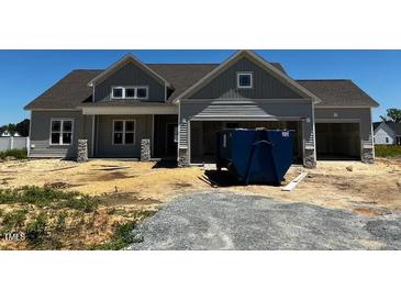 Charming single Gathering home, light gray, showing construction progress at 91 Retreat Run, Smithfield, NC 27577