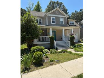 Charming two-story home with a welcoming front porch and well-maintained landscaping at 102 Kipling Dr, Oxford, NC 27565