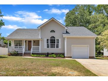 Charming single-Gathering home with a well-manicured lawn, porch, and attached garage in a suburban neighborhood at 316 Waterford Dr, Clayton, NC 27520