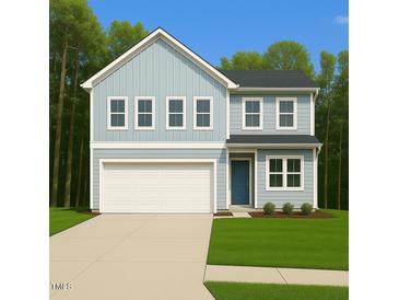 Charming two-story home with a light blue exterior, attached garage, and well-manicured lawn at 633 Conover Rd, Durham, NC 27703
