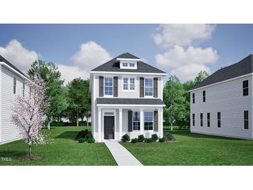 Charming two-story home with gray siding, dark shutters and a welcoming front porch at 756 Georgias Landing Pkwy # 3, Raleigh, NC 27603
