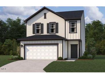 Charming two-story home featuring a two-car garage, black trim and window accents, and a cozy, covered entry way at 11147 Salers Loop, Middlesex, NC 27557