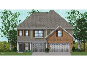 Charming two-story home featuring a brick facade, a two-car garage, and a welcoming front porch at 315 Augusta Pond Way # 169, Raleigh, NC 27603