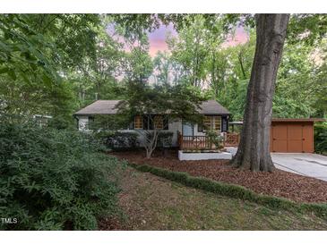 Charming single-story home with a landscaped front yard and welcoming entry porch at 421 Ridgefield Rd Rd, Chapel Hill, NC 27517