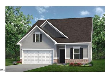 Charming two-story home featuring gray siding, black shutters, and an attached one-car garage at 55 E American Marigold Dr # 36, Benson, NC 27504
