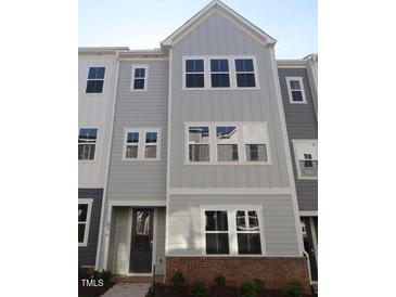 Charming two-story home featuring a modern design and neutral color palette at 806 Hillfarm Dr, Wake Forest, NC 27587