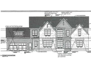 An elevation view reveals a home design with a single car garage, brick veneer foundation, and decorative gable vents at 110 Spanish Oak Dr, Youngsville, NC 27596