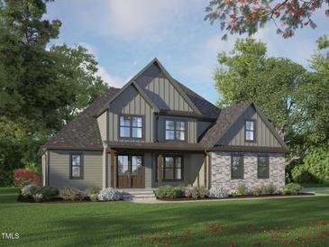 Charming new construction home featuring a stone accent facade, craftsman windows and lovely professional landscaping at 34 Cloudview Ct, Pittsboro, NC 27312