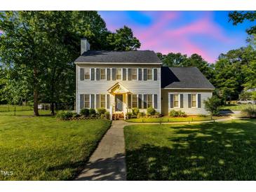 Charming two-story home features a well-manicured lawn, landscaped yard, and inviting front entrance at 540 W Juniper Ave, Wake Forest, NC 27587