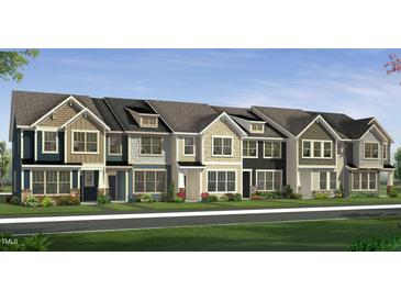 Charming townhome exteriors with craftsman details, varied siding, and colorful landscaping against a blue sky at 6443 Granite Quarry Dr, Raleigh, NC 27610
