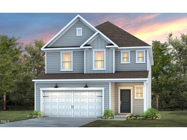 Charming two-story home featuring gray siding, a two-car garage, and a welcoming front entrance at 2924 Huxley Way, Apex, NC 27502