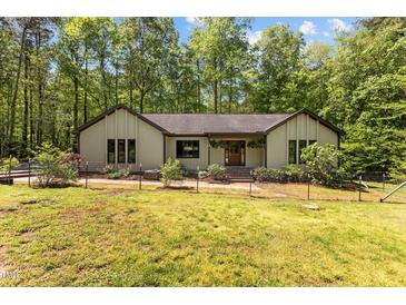 Charming single-story home with manicured lawn, landscaped flower beds, and inviting front entrance at 237 Jason Way, Youngsville, NC 27596