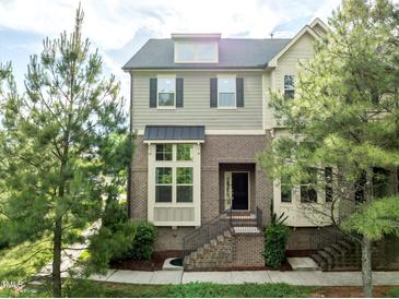 Charming two-story home with brick facade, landscaped yard, and inviting front entrance at 2316 Apex Peakway, Apex, NC 27502