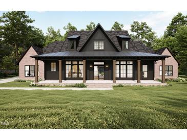Charming two-story home featuring a welcoming front porch and a lush green lawn at 300 Westerman Pl, Smithfield, NC 27577
