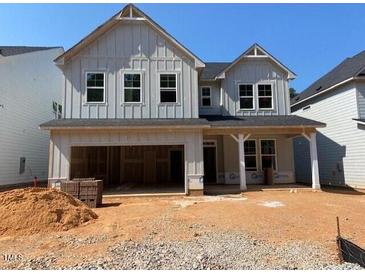New two-story home featuring board and batten siding and an attached two-car garage at 448 Golden Dragonfly St, Wake Forest, NC 27587
