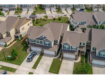 Beautiful aerial view of townhomes featuring a well-maintained community and landscaping at 210 Mayfield Dr, Apex, NC 27539