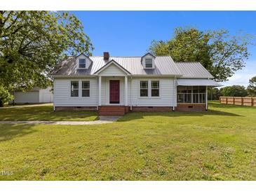 Charming one story home with landscaped front yard and metal roof at 2227 Us-15, Creedmoor, NC 27522