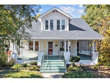 Charming two-story home featuring a welcoming front porch and landscaped front yard at 504 Hillcrest Ave, Burlington, NC 27215