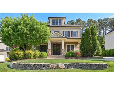 Charming two-story home with manicured lawn, stone accents, and a welcoming front porch at 528 Bankhead Dr, Cary, NC 27519