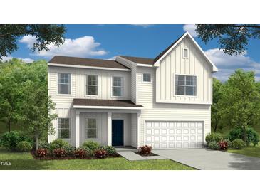 Charming two-story home with a white exterior, landscaped yard, and a welcoming front entrance at 86 Oak Meadow Ln, Angier, NC 27501